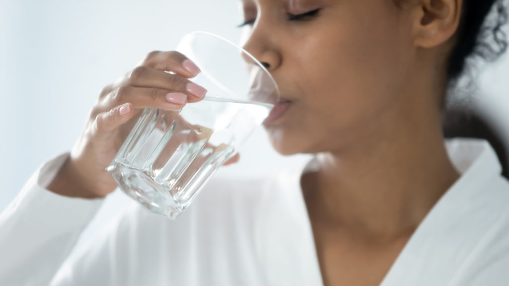 woman in Indio California drinking tap water